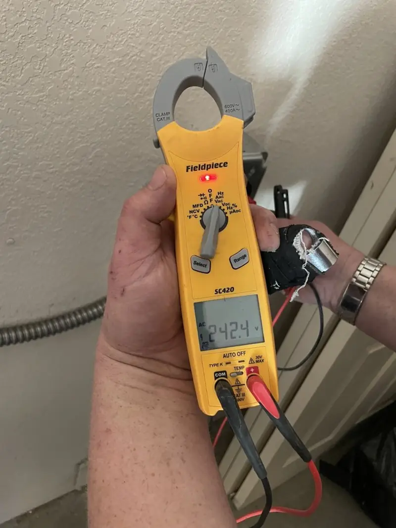 Voltage testing with clamp meter during Recessed Lighting Installation in Newcastle